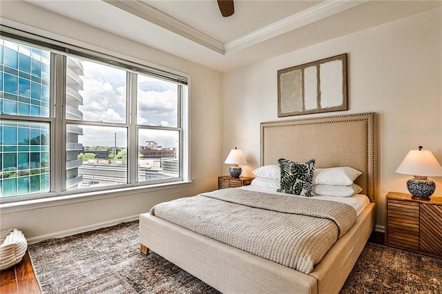 bedroom featuring multiple windows, ceiling fan, dark hardwood / wood-style flooring, and ornamental molding