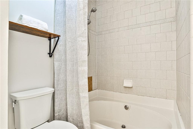 bathroom featuring shower / bath combo and toilet