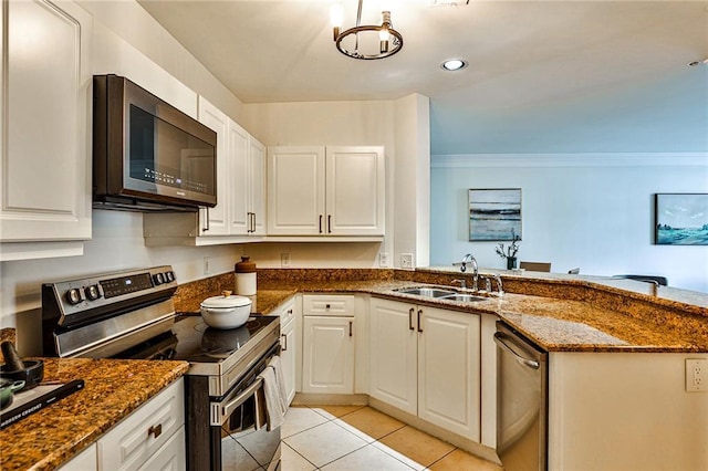 kitchen with white cabinets, stainless steel appliances, and sink