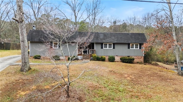 ranch-style home with a front yard