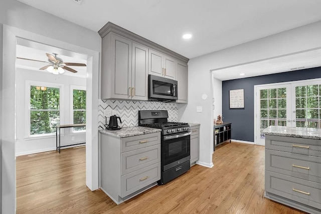 4066 Covered Bridge Rd SW, Smyrna, GA 30082 - kitchen featuring gray cabinetry, stainless steel appliances, ceiling fan, light wood-style flooring, and recessed lighting