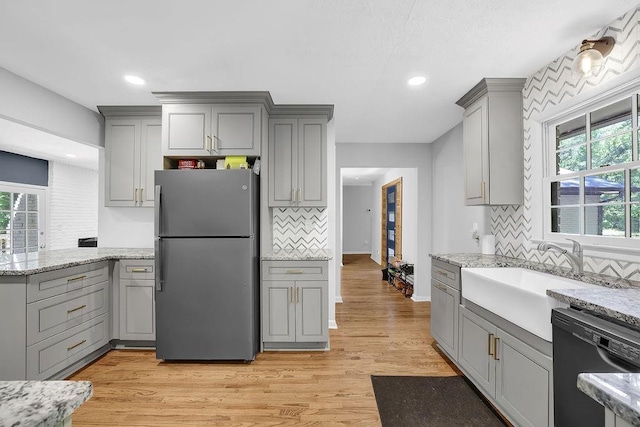 4066 Covered Bridge Rd SW, Smyrna, GA 30082 - kitchen featuring freestanding refrigerator, gray cabinets, dishwasher, backsplash, and recessed lighting