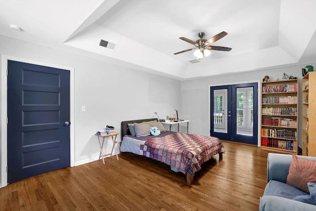 4066 Covered Bridge Rd SW, Smyrna, GA 30082 - bedroom with a raised ceiling, wood finished floors, access to exterior, and baseboards