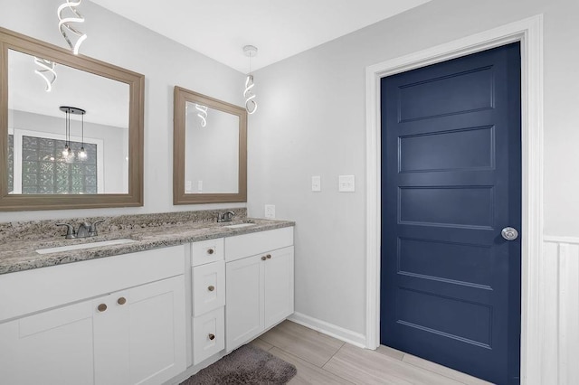4066 Covered Bridge Rd SW, Smyrna, GA 30082 - bathroom with double vanity and baseboards
