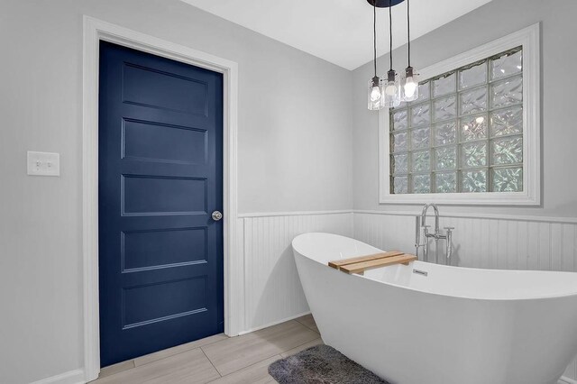 4066 Covered Bridge Rd SW, Smyrna, GA 30082 - full bath featuring a soaking tub and a wainscoted wall