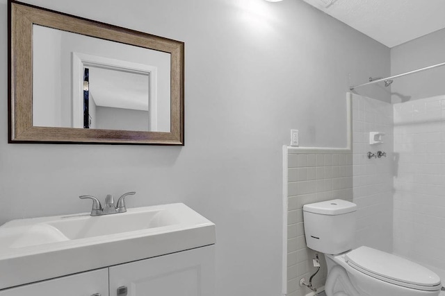 4066 Covered Bridge Rd SW, Smyrna, GA 30082 - full bathroom with toilet, vanity, tiled shower, and tile walls