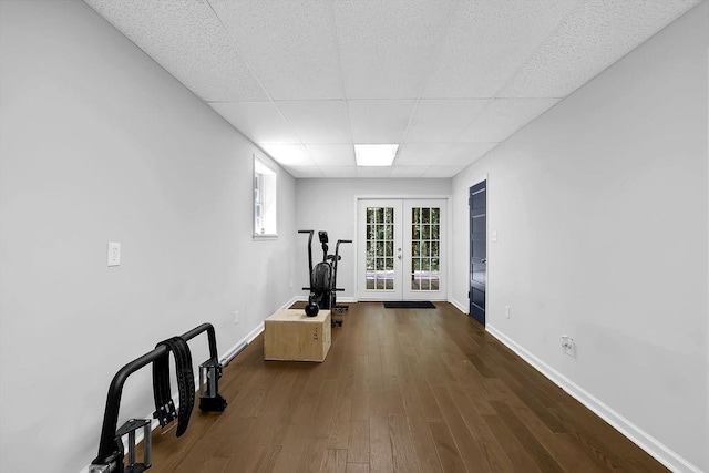 4066 Covered Bridge Rd SW, Smyrna, GA 30082 - exercise room featuring french doors, a paneled ceiling, dark wood-type flooring, and baseboards