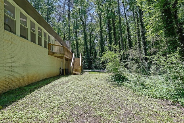 4066 Covered Bridge Rd SW, Smyrna, GA 30082 - view of yard with stairway and a deck