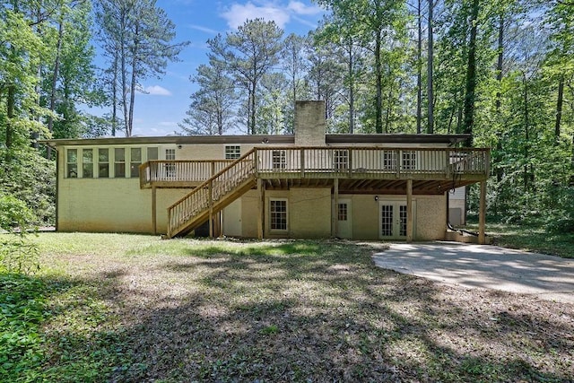 4066 Covered Bridge Rd SW, Smyrna, GA 30082 - rear view of house with french doors, a deck, a chimney, and stairs