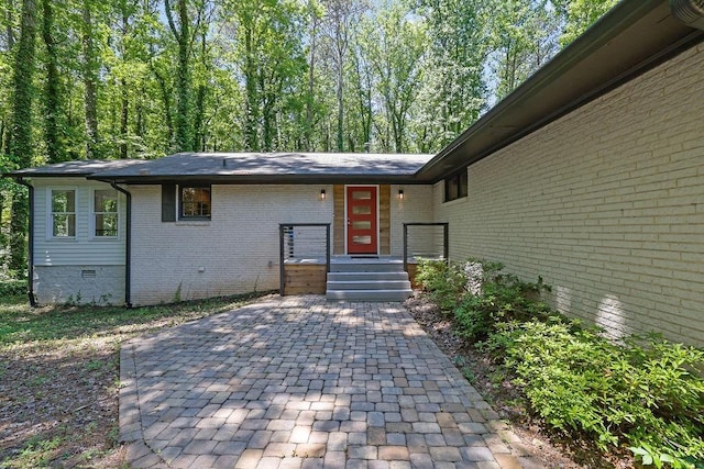 4066 Covered Bridge Rd SW, Smyrna, GA 30082 - doorway to property with brick siding and crawl space