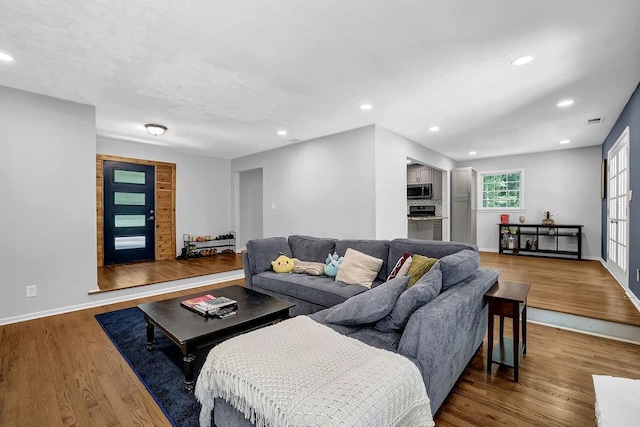 4066 Covered Bridge Rd SW, Smyrna, GA 30082 - living room featuring recessed lighting, wood finished floors, and baseboards