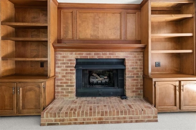 127 Roe Hampton Ln, Stone Mountain, GA 30087 - detailed view of built in shelves, a fireplace, and carpet flooring