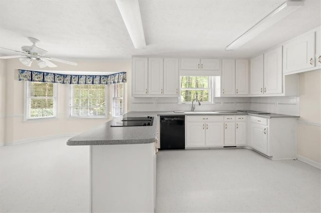 127 Roe Hampton Ln, Stone Mountain, GA 30087 - kitchen featuring black appliances, a peninsula, white cabinetry, a textured ceiling, and a ceiling fan