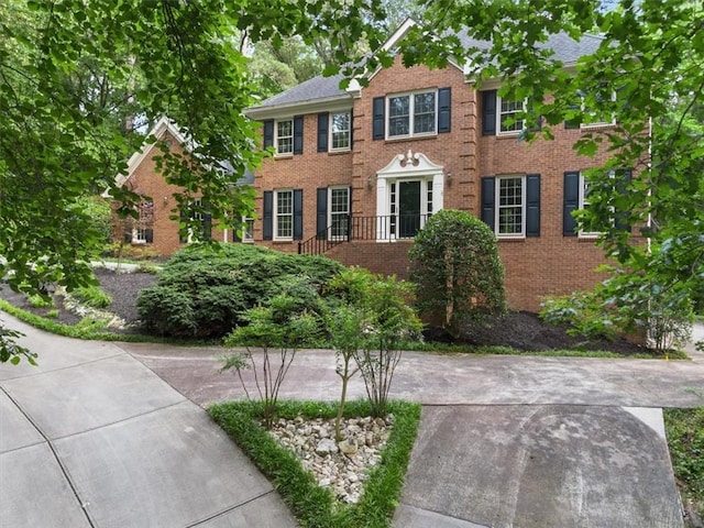 127 Roe Hampton Ln, Stone Mountain, GA 30087 - colonial house featuring brick siding