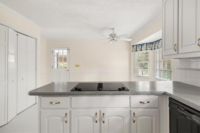127 Roe Hampton Ln, Stone Mountain, GA 30087 - kitchen with black appliances, white cabinets, a ceiling fan, and a peninsula
