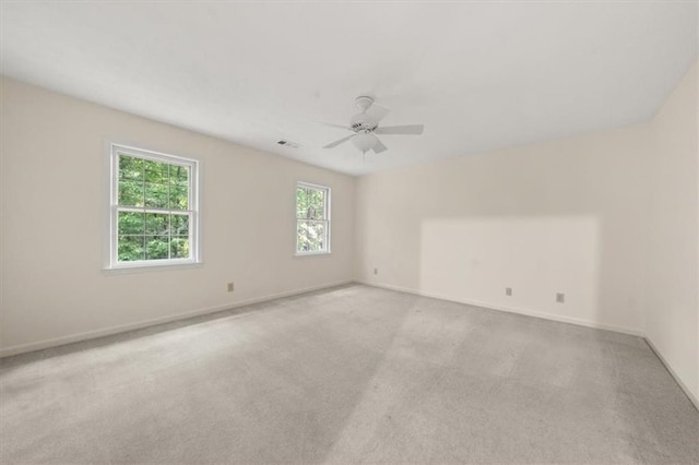 127 Roe Hampton Ln, Stone Mountain, GA 30087 - spare room featuring carpet flooring and ceiling fan