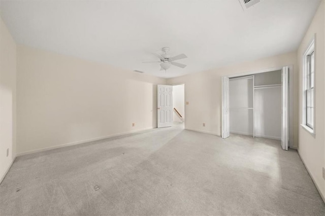 127 Roe Hampton Ln, Stone Mountain, GA 30087 - unfurnished bedroom with a closet, carpet, and a ceiling fan