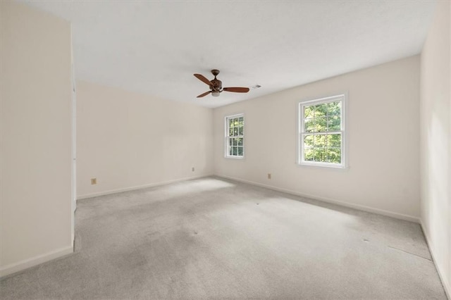 127 Roe Hampton Ln, Stone Mountain, GA 30087 - carpeted spare room with a ceiling fan and baseboards