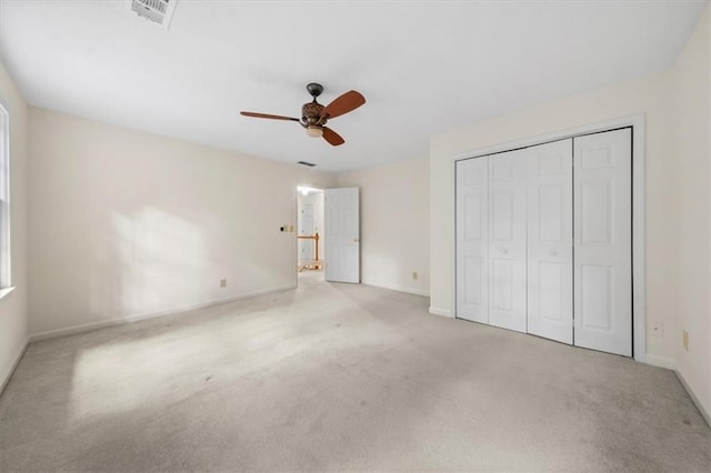 127 Roe Hampton Ln, Stone Mountain, GA 30087 - unfurnished bedroom with carpet floors, a closet, and a ceiling fan