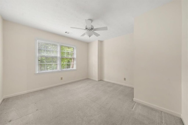 127 Roe Hampton Ln, Stone Mountain, GA 30087 - unfurnished room with light colored carpet and a ceiling fan