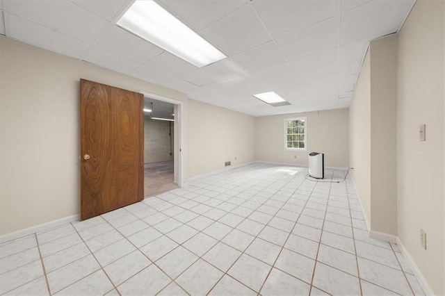 127 Roe Hampton Ln, Stone Mountain, GA 30087 - spare room with light tile patterned flooring and a paneled ceiling