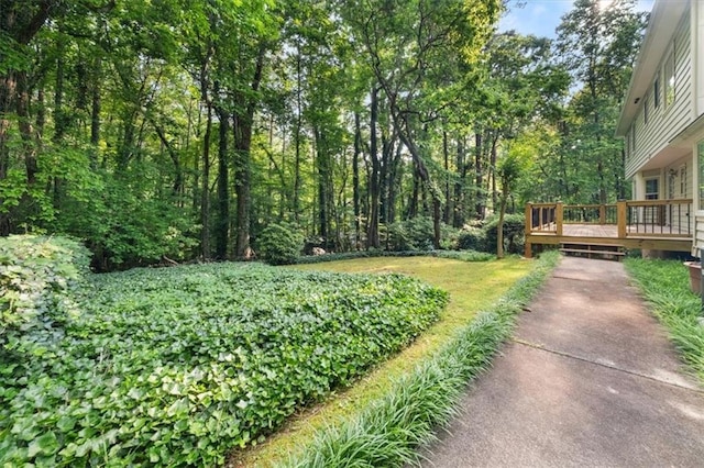 127 Roe Hampton Ln, Stone Mountain, GA 30087 - view of yard with a wooden deck