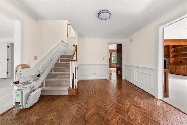 127 Roe Hampton Ln, Stone Mountain, GA 30087 - staircase with a decorative wall, wainscoting, and ornamental molding