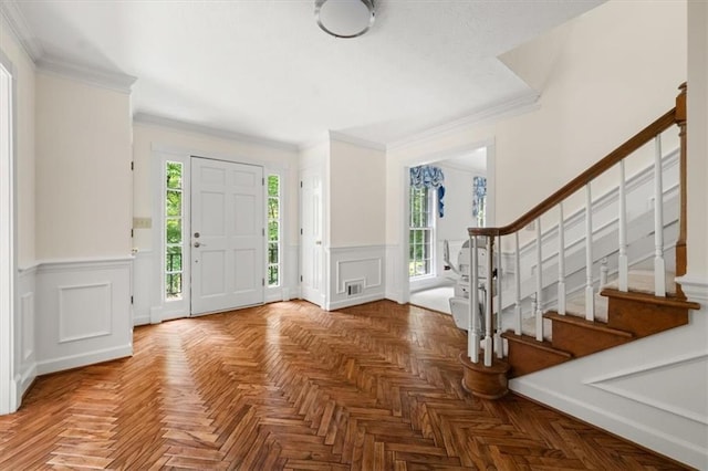 127 Roe Hampton Ln, Stone Mountain, GA 30087 - foyer entrance with stairs, a wainscoted wall, ornamental molding, and a decorative wall