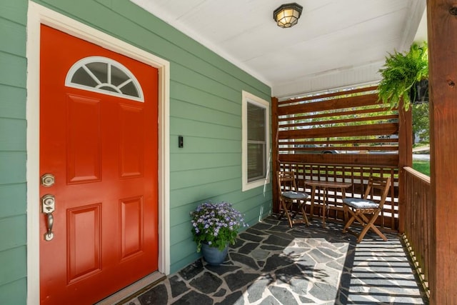 entrance to property featuring a porch