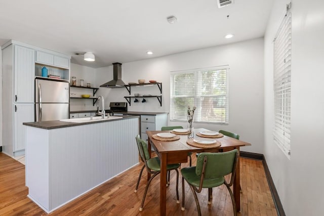 dining area with recessed lighting, visible vents, and light wood-type flooring