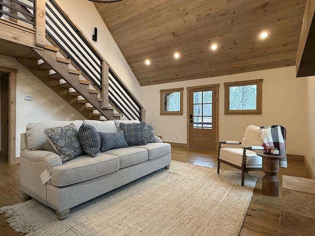 living room with lofted ceiling, hardwood / wood-style flooring, and wooden ceiling