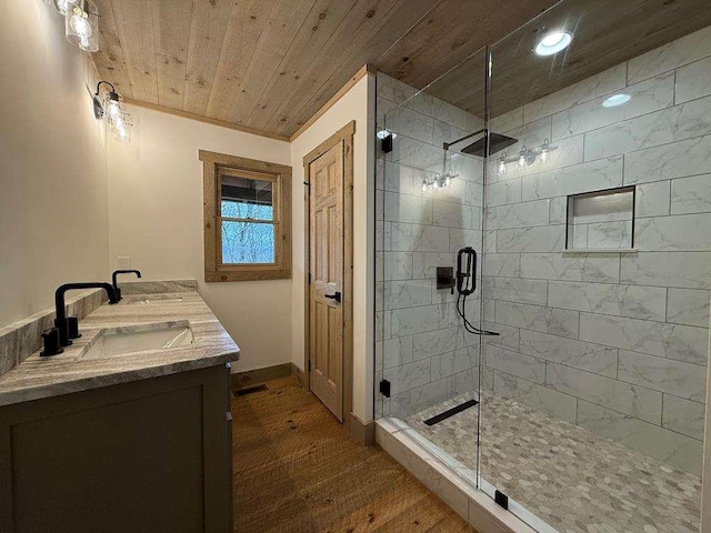 bathroom featuring walk in shower, vanity, hardwood / wood-style floors, and wooden ceiling