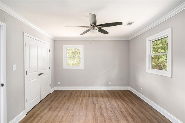 1521 Bonner Gilbert Rd, Macon, GA 31220 - unfurnished bedroom with wood finished floors, crown molding, a closet, and a ceiling fan