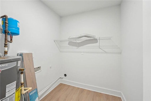 2105 Royal Fox Way, Decatur, GA 30032 - washroom featuring light wood-style flooring, hookup for an electric dryer, washer hookup, and baseboards