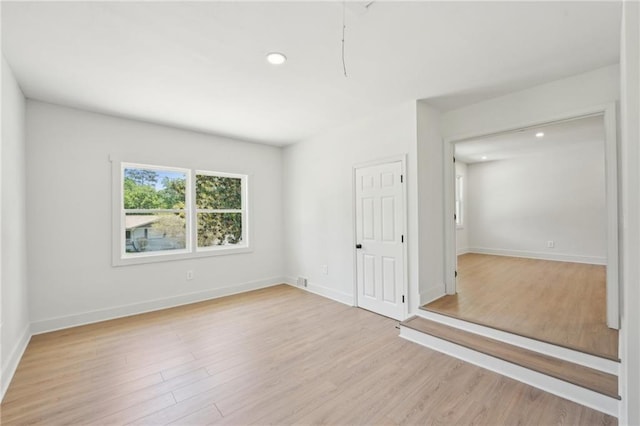 2105 Royal Fox Way, Decatur, GA 30032 - unfurnished bedroom with light wood-style flooring, recessed lighting, and baseboards
