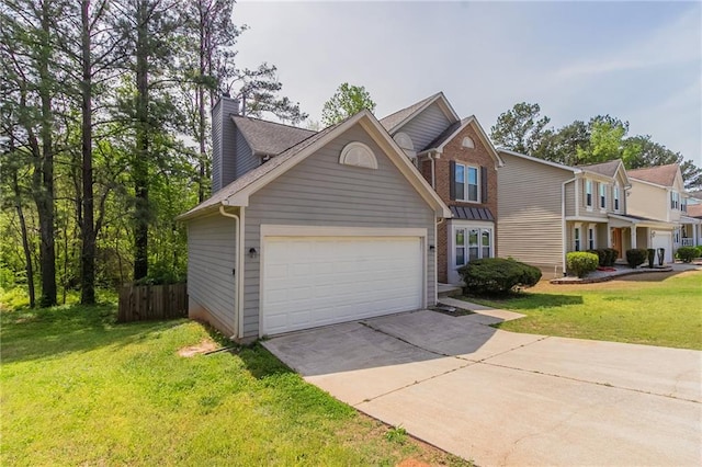 traditional-style home featuring driveway, fence, a garage, brick siding, and a front yard