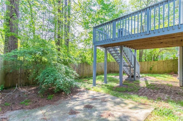 view of patio / terrace featuring stairway, a fenced backyard, and a deck