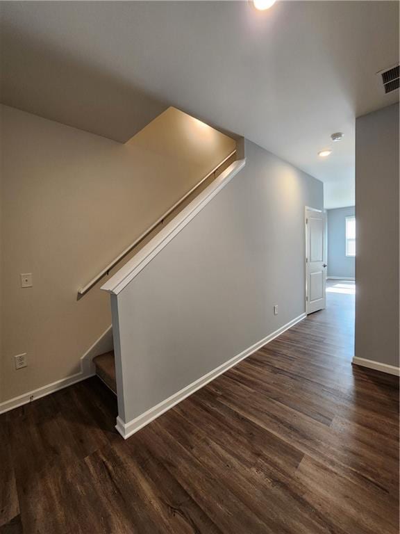 stairway with wood-type flooring