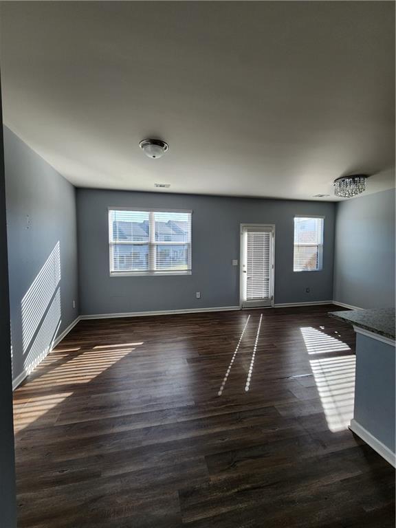 spare room featuring dark hardwood / wood-style flooring