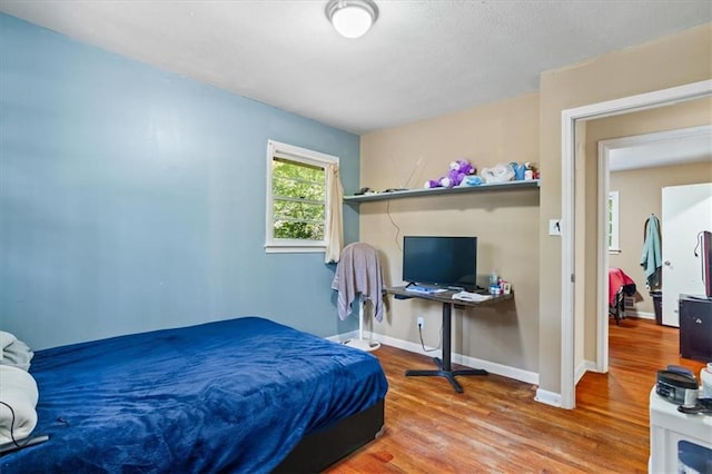 bedroom featuring hardwood / wood-style floors