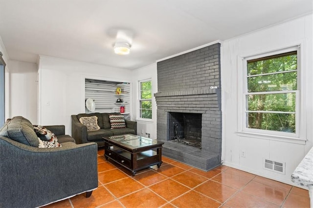 tiled living room featuring a fireplace