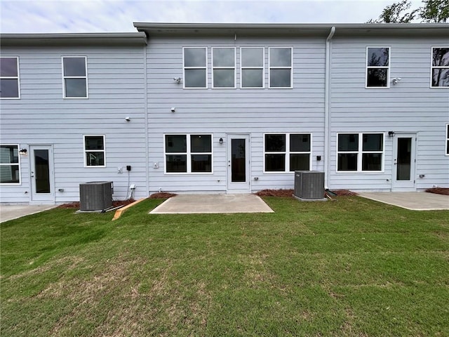 1958 Asher Ln Unit 50, Conyers, GA 30013 - back of property featuring a patio area, central air condition unit, and a lawn