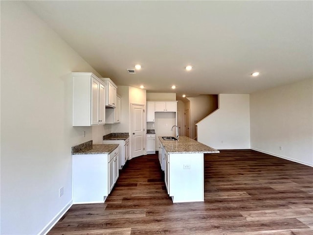 1958 Asher Ln Unit 50, Conyers, GA 30013 - kitchen featuring a sink, baseboards, dark wood finished floors, and recessed lighting