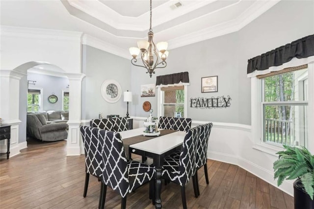 270 Morrow Rd, Newborn, GA 30056 - dining space featuring arched walkways, decorative columns, hardwood / wood-style floors, a chandelier, and a tray ceiling