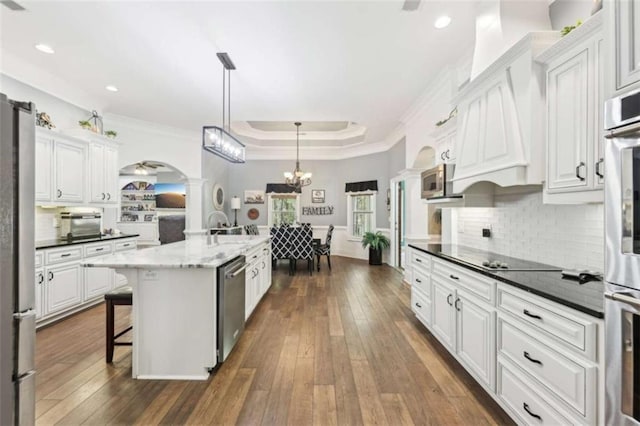 270 Morrow Rd, Newborn, GA 30056 - kitchen featuring ornate columns, appliances with stainless steel finishes, crown molding, arched walkways, and dark wood-type flooring