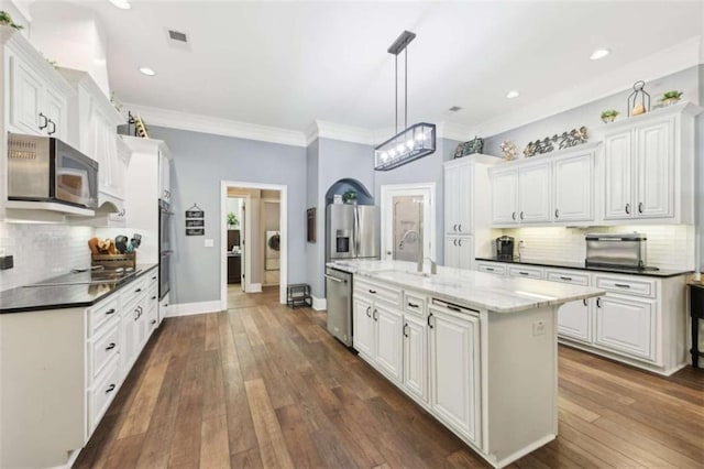 270 Morrow Rd, Newborn, GA 30056 - kitchen featuring stainless steel appliances, a sink, backsplash, white cabinets, and ornamental molding