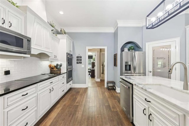 270 Morrow Rd, Newborn, GA 30056 - kitchen with stainless steel appliances, a sink, backsplash, ornamental molding, and white cabinetry