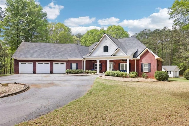 270 Morrow Rd, Newborn, GA 30056 - view of front of house featuring asphalt driveway, a garage, a front yard, and brick siding