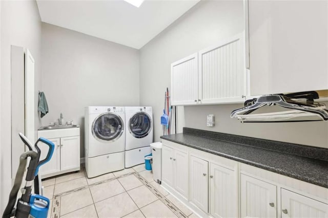 270 Morrow Rd, Newborn, GA 30056 - laundry area with cabinet space, washer and dryer, and light tile patterned flooring