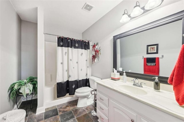 270 Morrow Rd, Newborn, GA 30056 - full bath featuring vanity, toilet, stone finish flooring, and baseboards